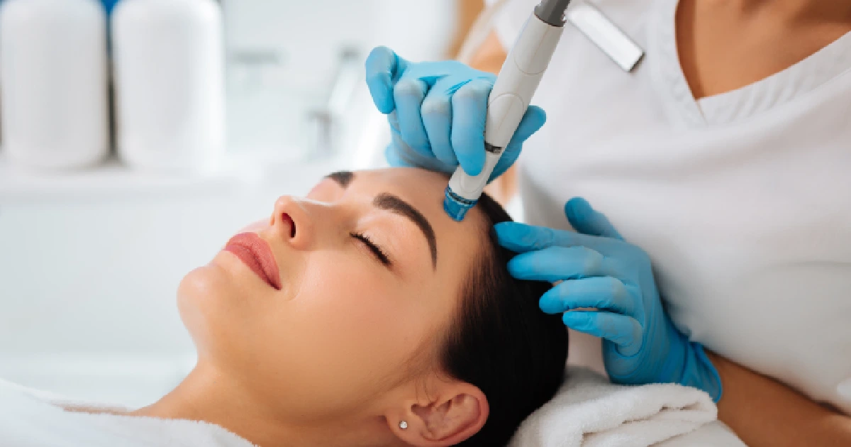 A woman receiving a HydraFacials in Lehi, UT